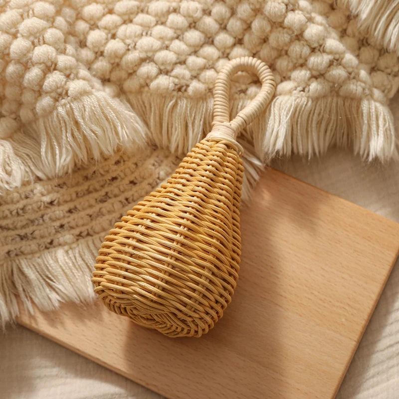 Product photo of Rattan Baby Rattle, the best Rattles gift idea for sale on Glenmore, a store where you can find the perfect Toy for your home, hobbies, video games, or gifting—all in one place, curated for you.
