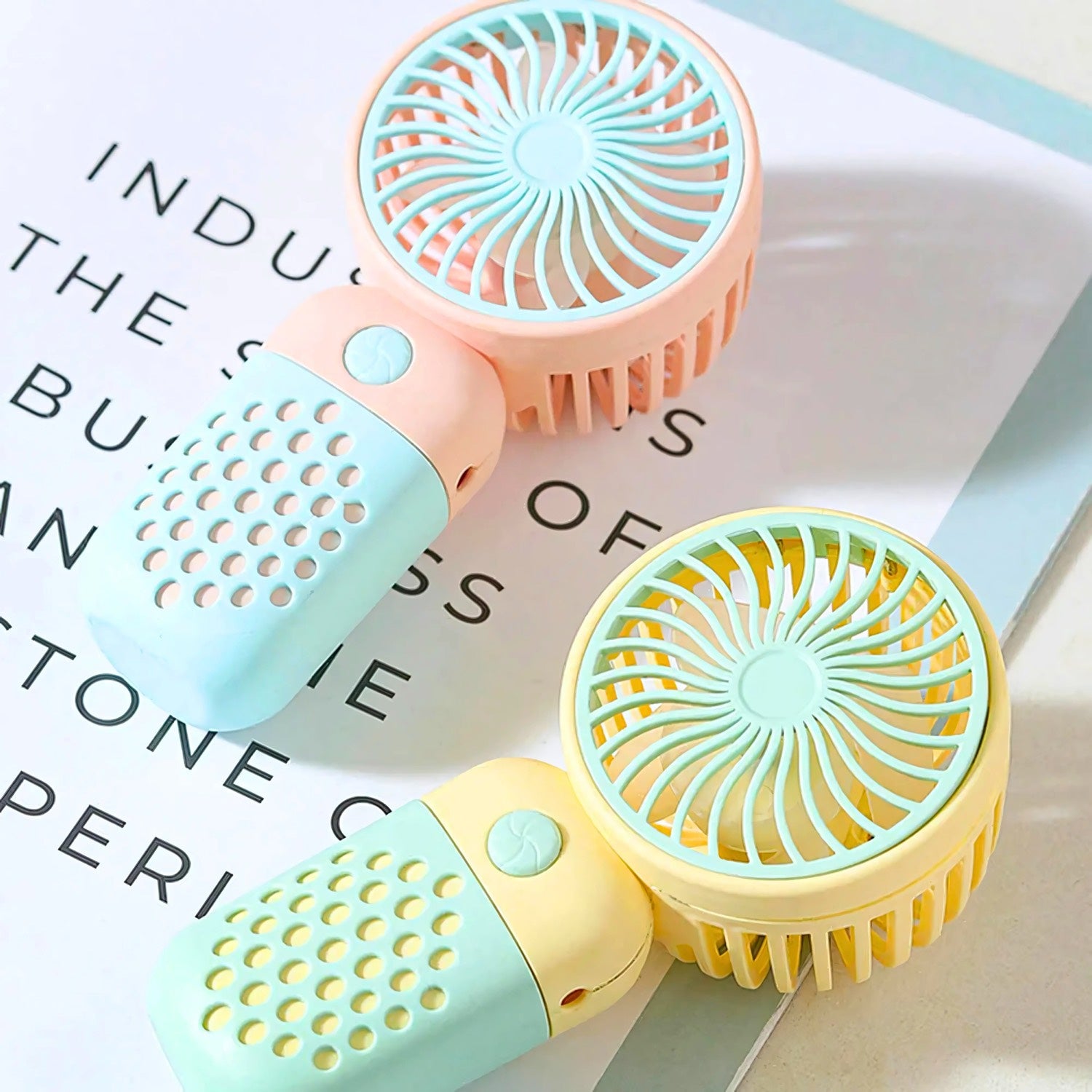 Product photo of Mini Handheld Fan, the best Powered Hand Fans & Misters gift idea for sale on Glenmore, a store where you can find the perfect Electronics for your home, hobbies, video games, or gifting—all in one place, curated for you.